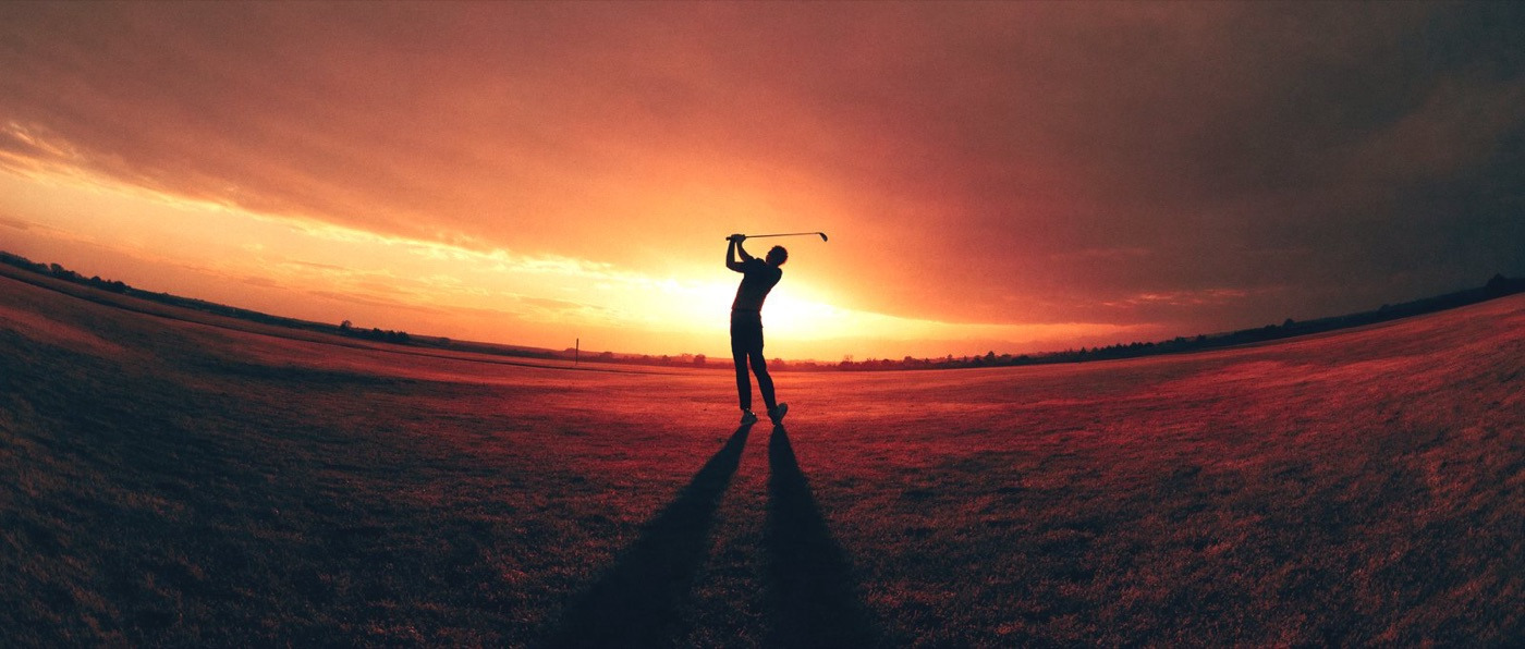 Apex Performance: a golfer silhouetted against a sunset